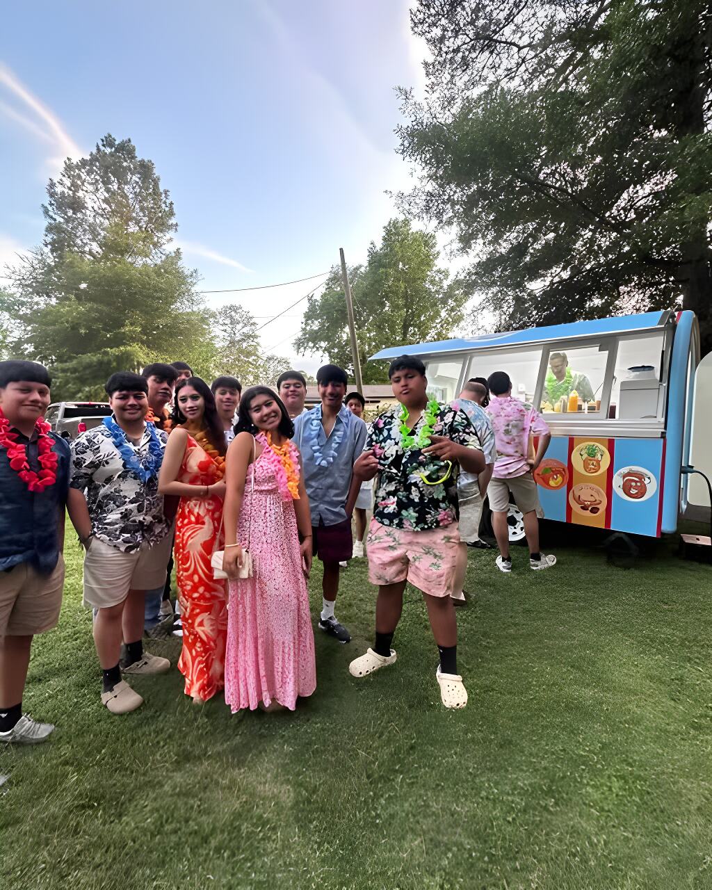 Guests in leis lined up at The Mini during a backyard party